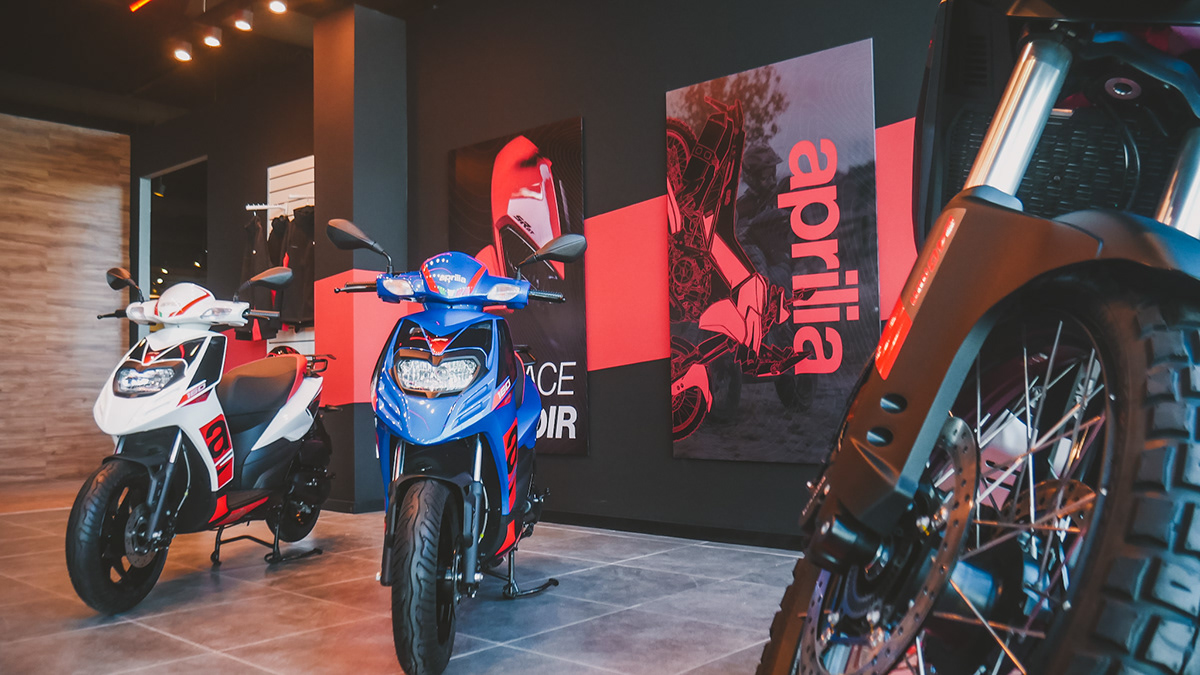 Wide view of Aprilia showroom poster installation